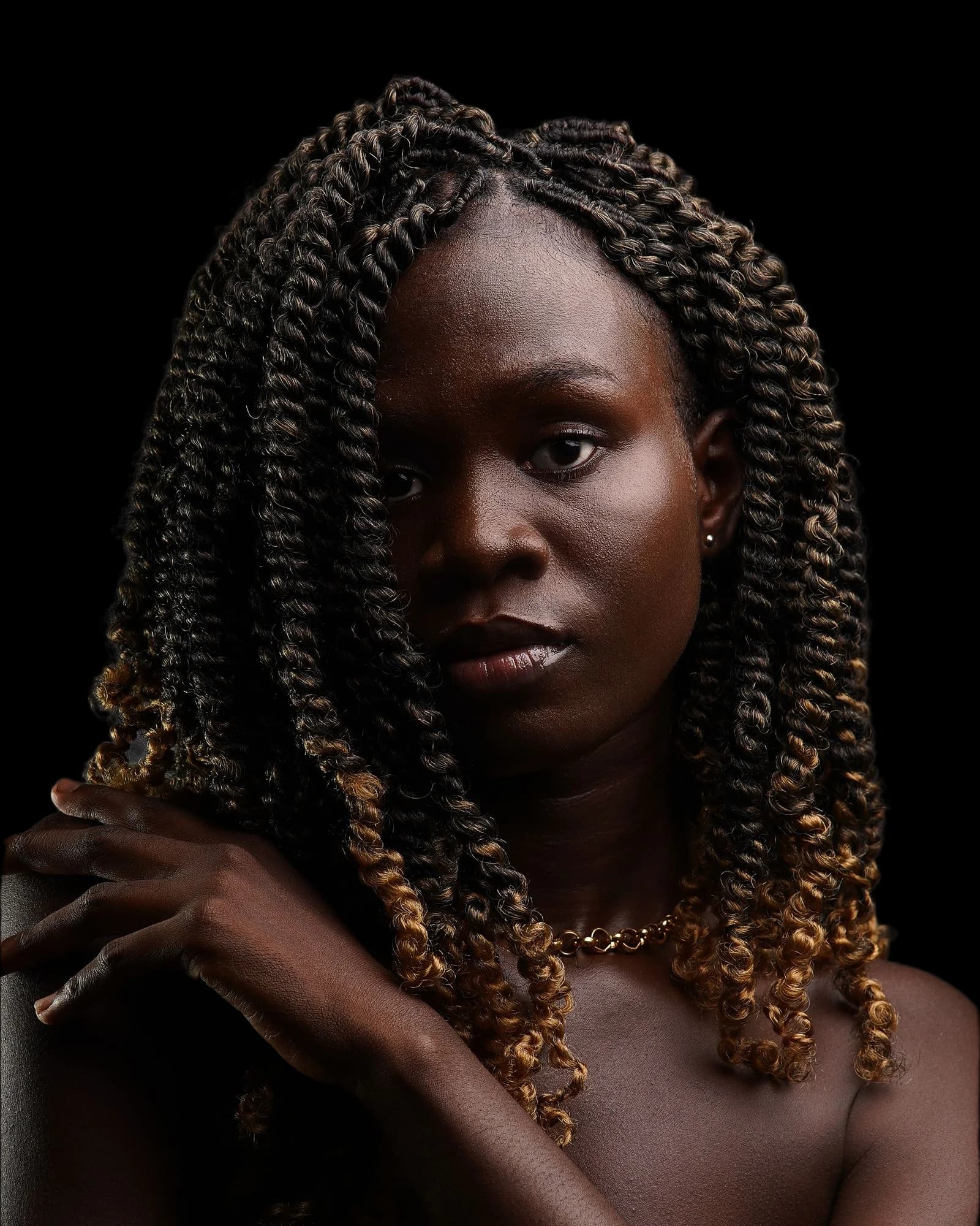 Portrait of a woman with long braided hair, background removed